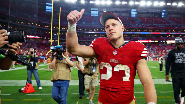 Dec 17, 2023; Glendale, Arizona, USA; San Francisco 49ers running back Christian McCaffrey (23) celebrates after beating the Arizona Cardinals at State Farm Stadium. Mandatory Credit: Mark J. Rebilas-USA TODAY Sports  